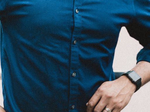 person in blue button up long sleeve shirt