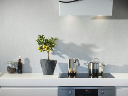 silver pot on top of induction oven