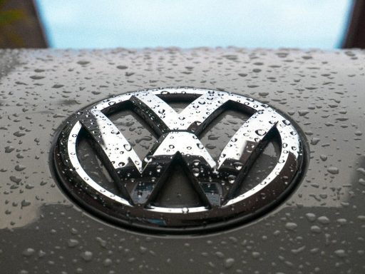water dew on silver Volkswagen car emblem